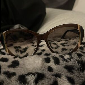 I have a brand new pair of womens Salvatore Ferragamo sunglasses.